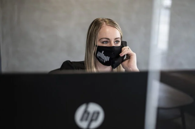 Receptionist wearing face mask